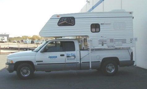 short bed camper on a long bed truck.JPG