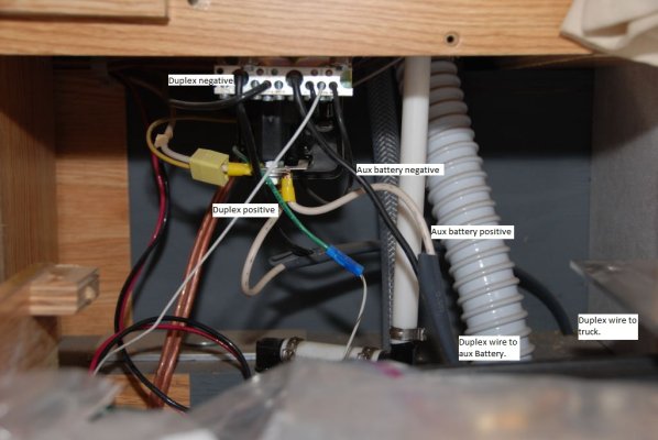 battery separator with ground bar labeled with auxx battery.JPG