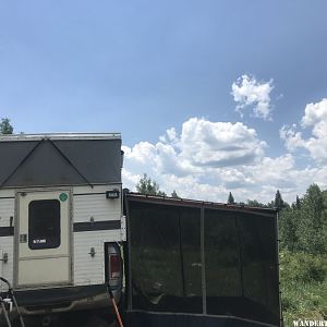 Granby camper popped up with awning and screen room