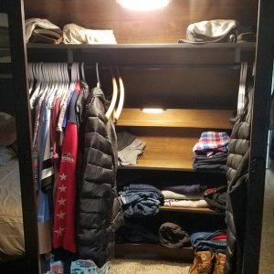 Relocated OEM small overhead closet light down to lower closet shelves. Then I installed the OEM light from above recliners where the existing closet 