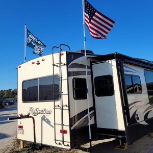 Added flagpole holders that turn 90° and stow away under the camper.