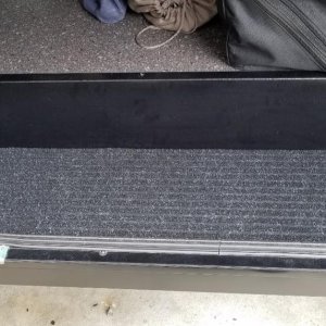 Reinforced the cargo area plastic tray with 1/2" plywood and trunk liner carpet.