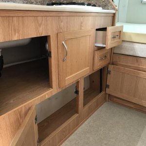 Storage under galley counter