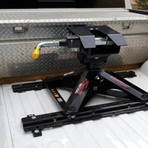 Demco Recon fifth wheel hitch.  The pyramid platform design leaves a lot of free space in the bed, head tilts in both directions.  Also comes in a goo