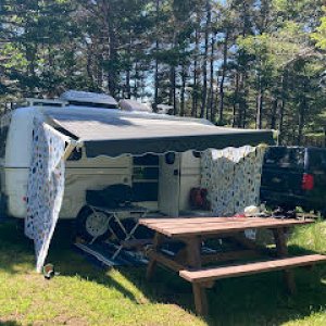 Rigged for possible rain, we can add an additional small brown tarp to the front of the awning if the wind is blowing in the wrong direction. We like 