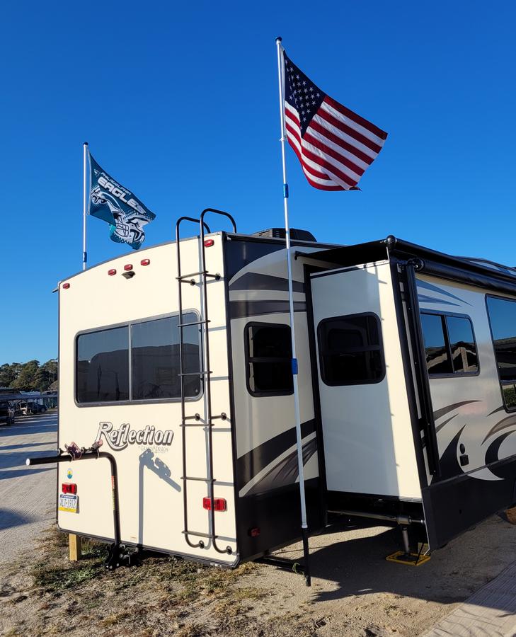 Added flagpole holders that turn 90° and stow away under the camper.