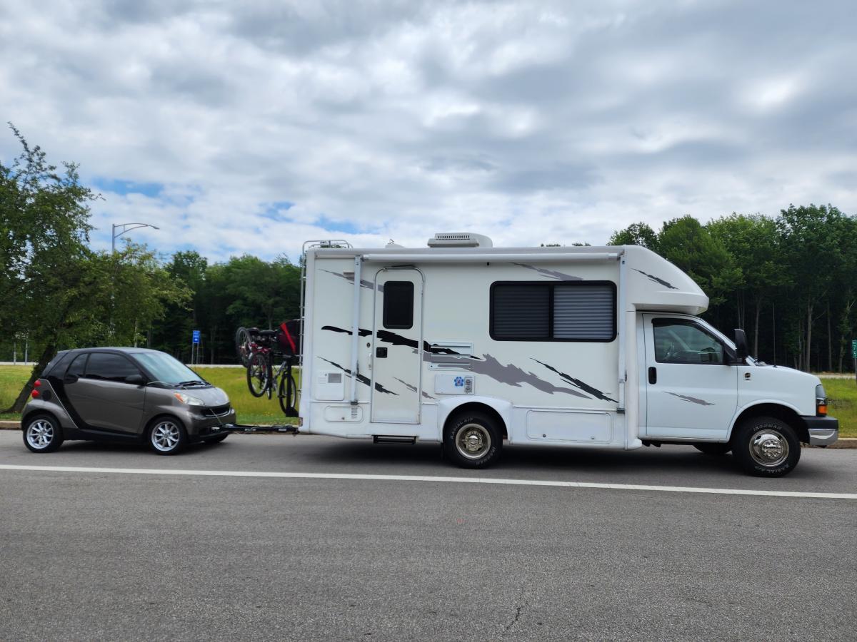 full rig towing 09 smart car with bike rack attachment.....