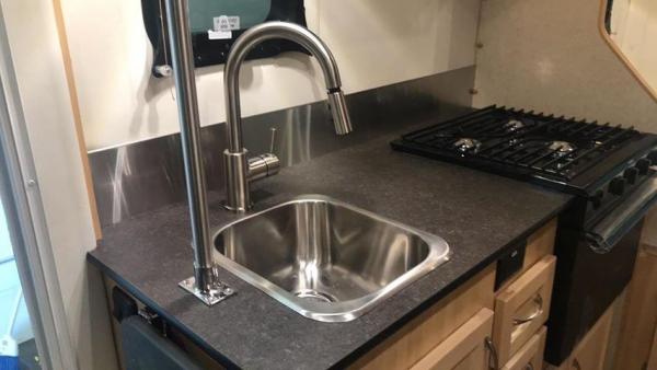 Kitchen with Stainless Backsplash