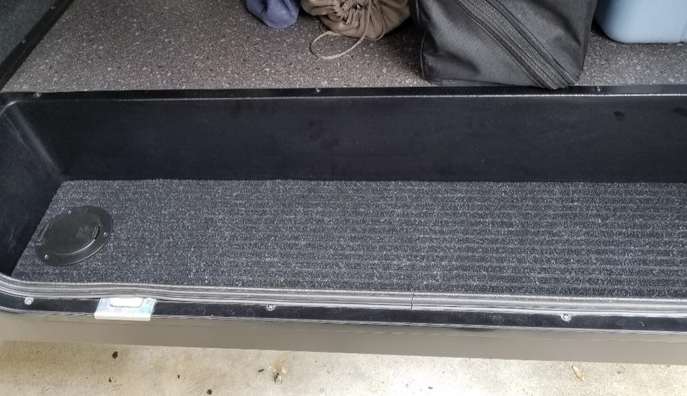 Reinforced the cargo area plastic tray with 1/2" plywood and trunk liner carpet.