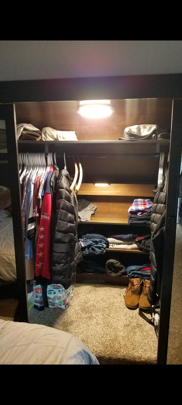 Relocated OEM small overhead closet light down to lower closet shelves. Then I installed the OEM light from above recliners where the existing closet 