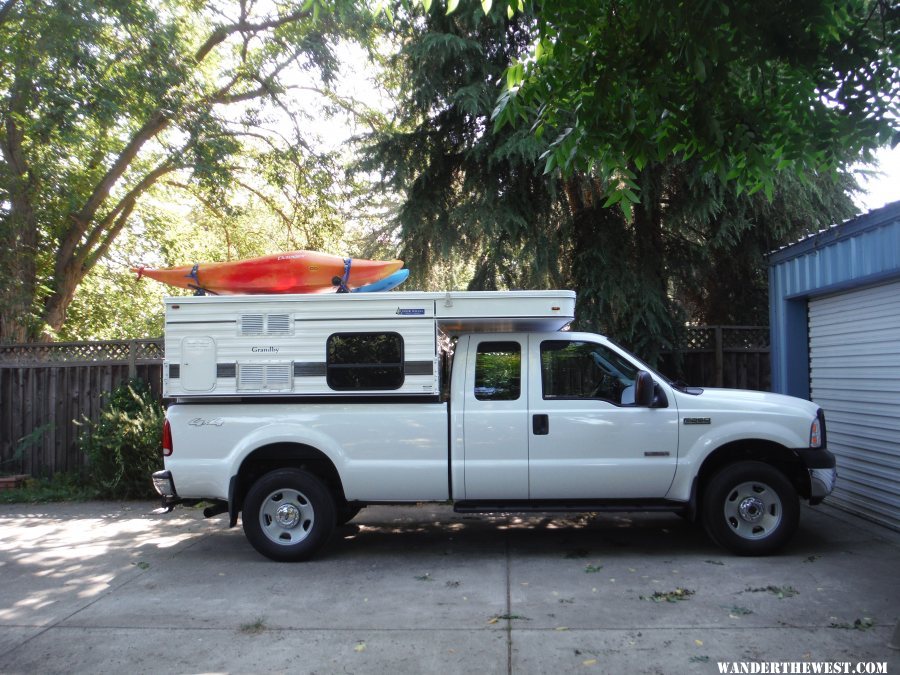 River boats on camper in driveway