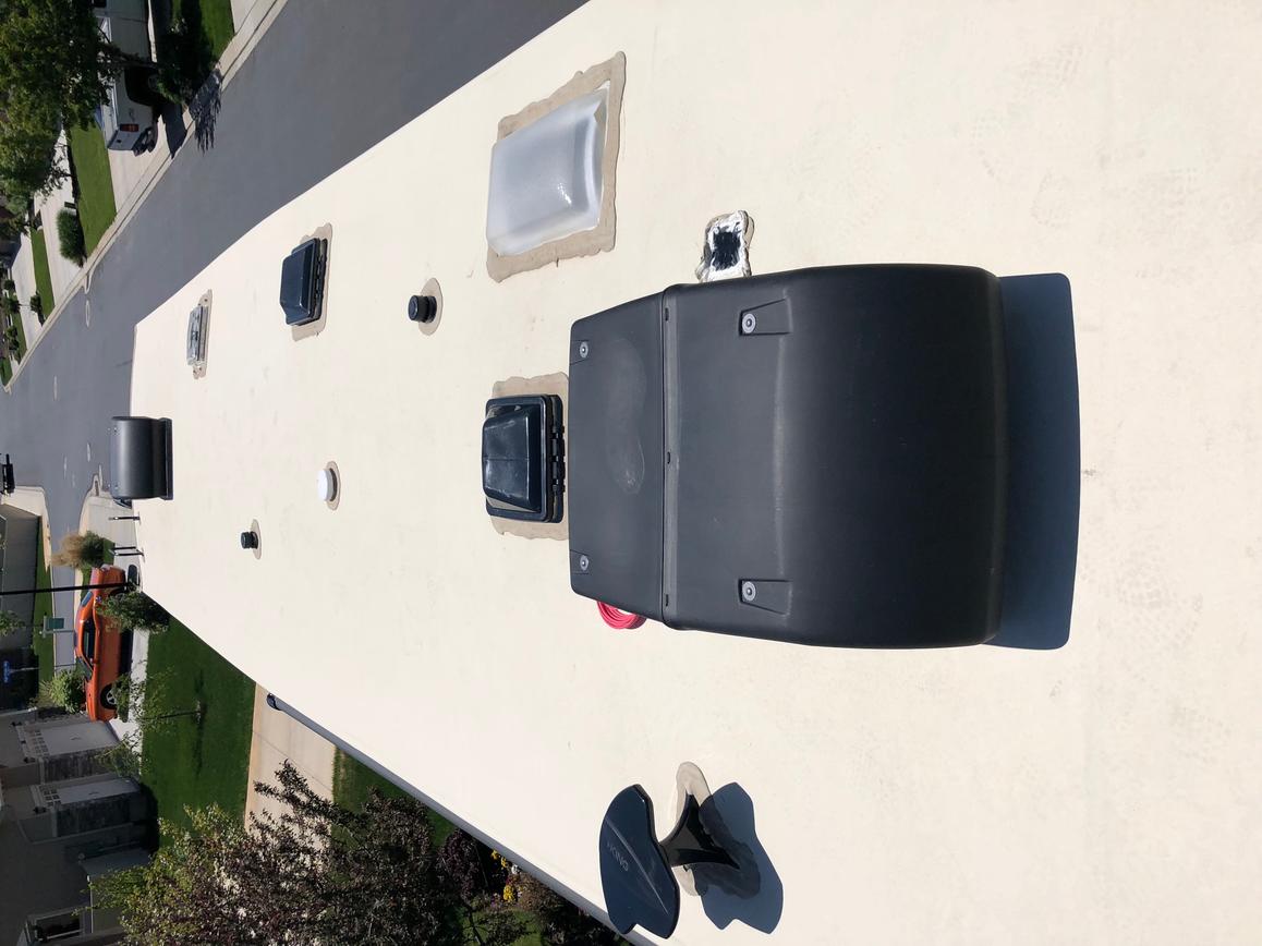 Roof of RV before Solar was added.  You can see the basement access panel just to the right of the AC unit.