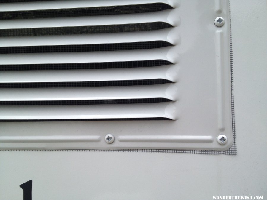 screen behind upper fridge vent