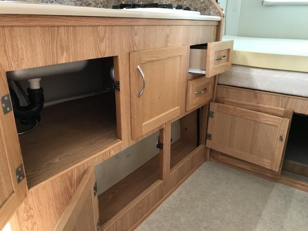 Storage under galley counter