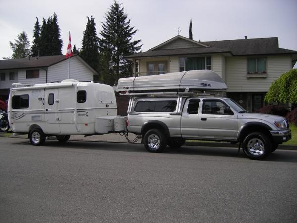 The whole setup:
Motorcycle & rack; boat loader & boat.
When I ordered the trailer, I asked Tammy if it was okay to NOT put the large Escape logo on t