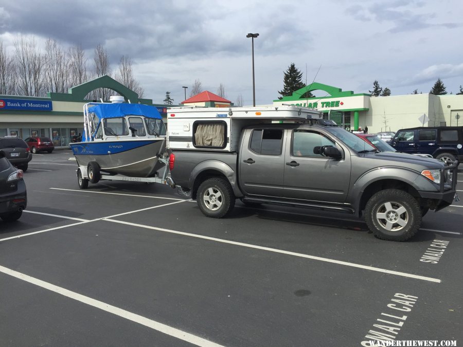 Truck and Camper towing 18 foot hewescraft searunner