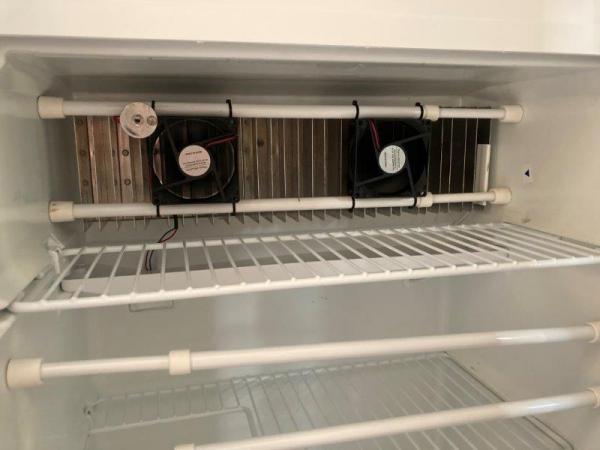 two small 12V fans were mounted in the refrigerator to circulate air, even out the temperature, reduce propane usage.
very easy install, no holes to d