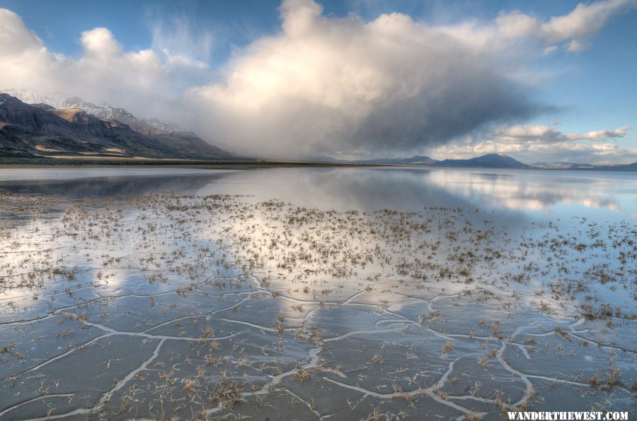 Wet cracks, water, and cloud with mountain